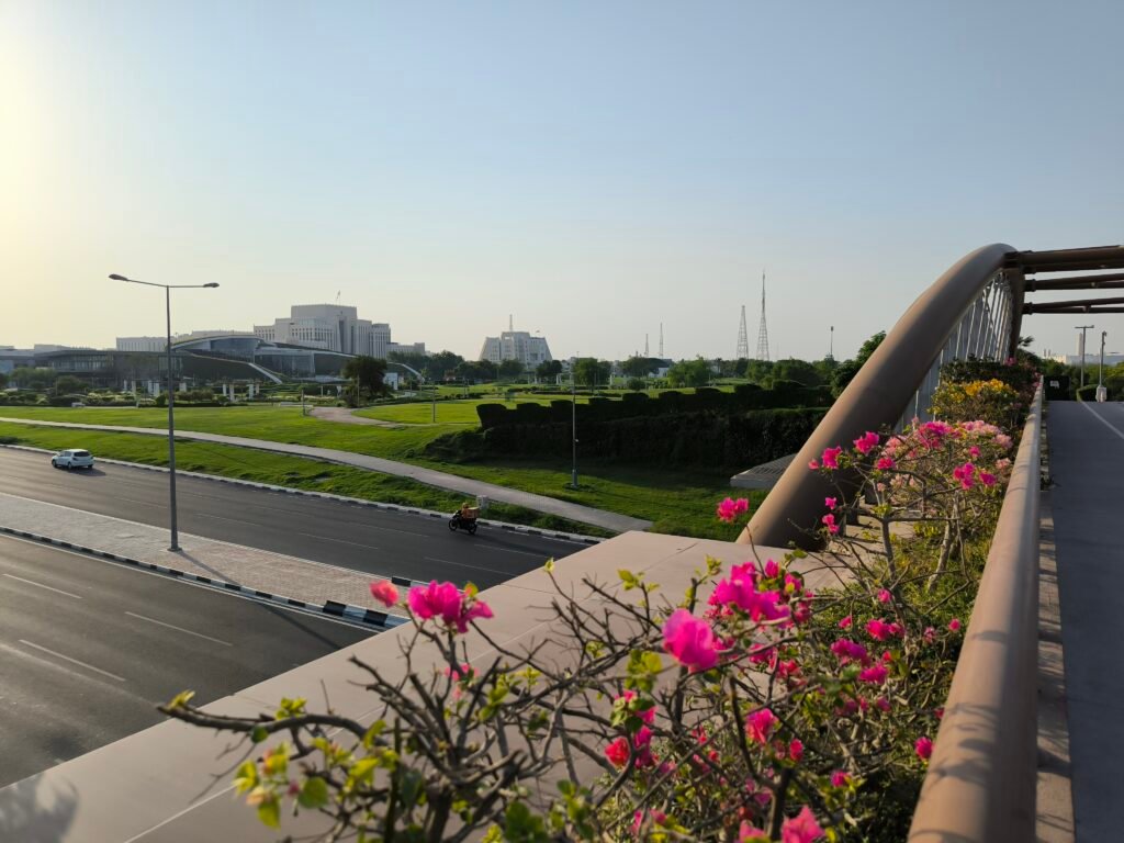 A bridge across a large road, leading from one part of the part to another.